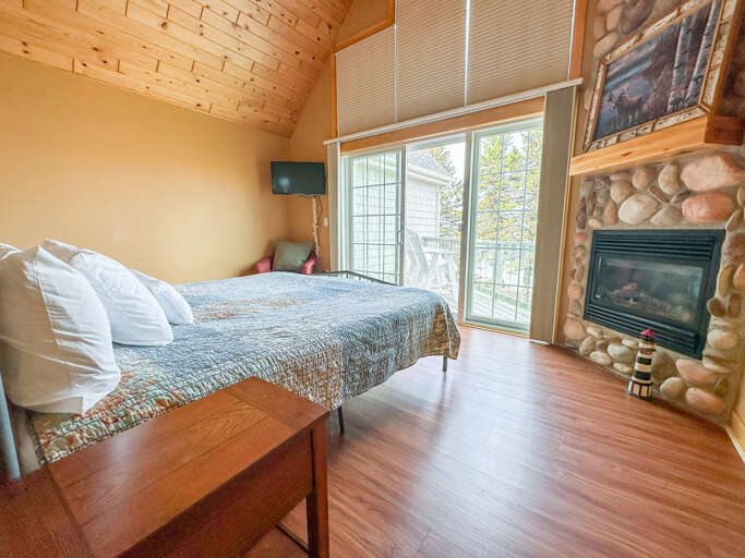 Upstairs you will find the two bedrooms. Bedroom 1 has amazing Grand Marais Harbor views!