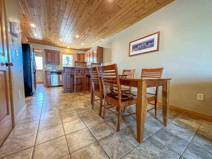 There is a dining area with seating for four. There is a dining area with seating for four.