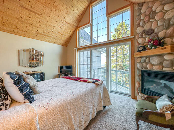 Bedroom 1 has a queen bed and Lake Superior views.