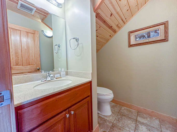 Half bathroom off the dining room. Half bathroom off the dining room.