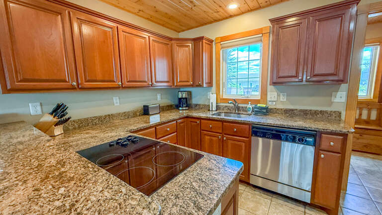 Your fully equipped kitchen features granite countertops, stainless steel appliances, and everything you need to prepare delicious meals during your stay.