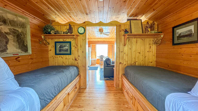 The bedroom features two twin beds.