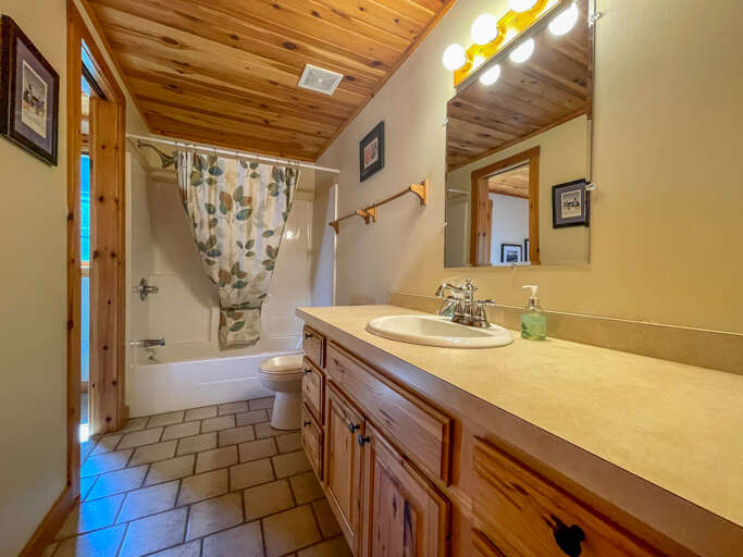 Attached to the bedroom is master bathroom with a shower/tub combo