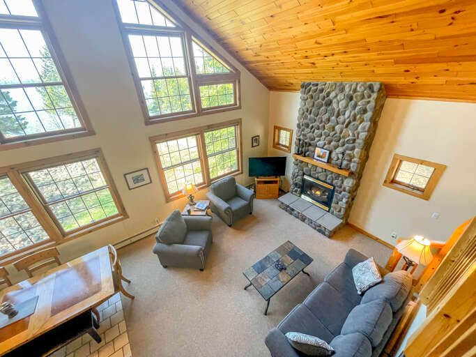 The beautiful 2-story windows allow you to take full advantage of the Devil Track Lake views year-round