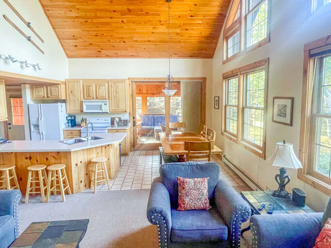 The living room is open to the kitchen and dining room