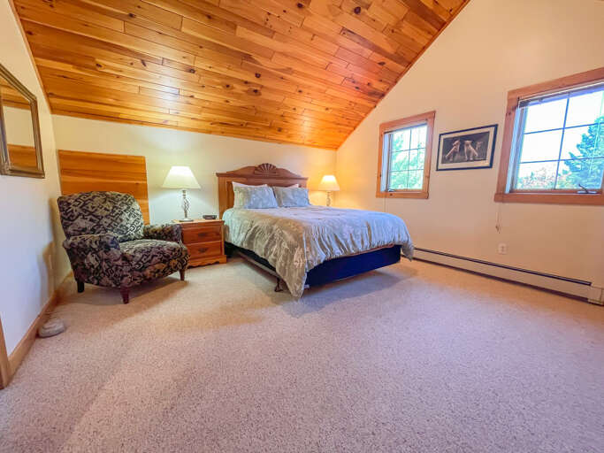 This master bedroom is located on the upper level