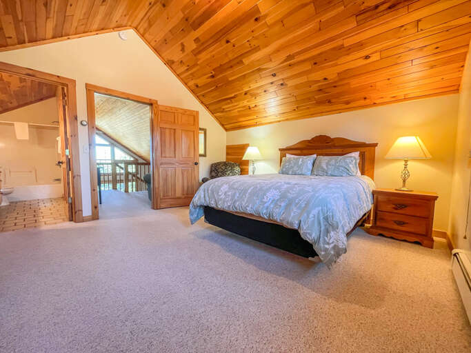 Relax in the spacious master bedroom after a long day of adventures
