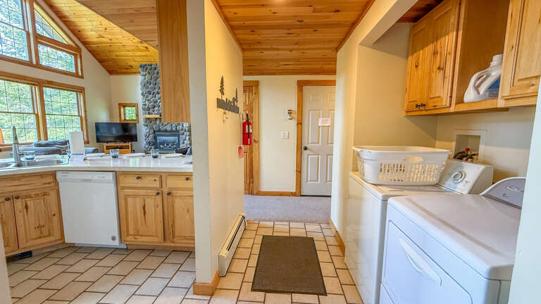 Step into your home away from homeâwarm wood ceilings, full kitchen, cozy stone fireplace, and in-unit laundry make this space perfectly yours.