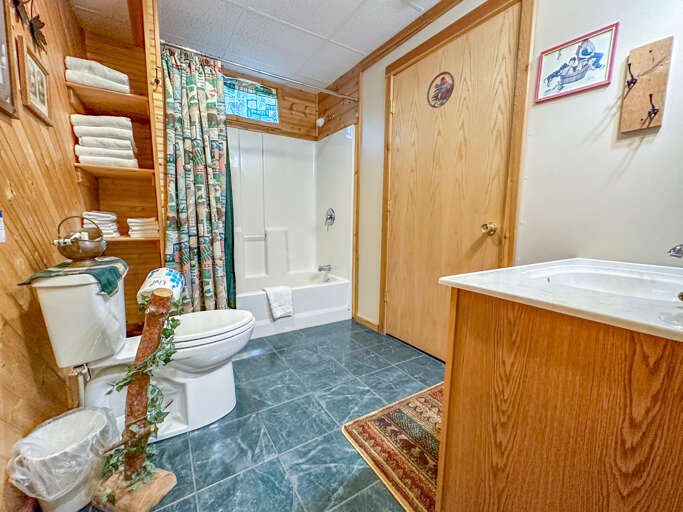 Bathroom on the lower level with a shower/tub combo.