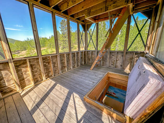 Take the stairs up to the second level of the Eagle's Nest.