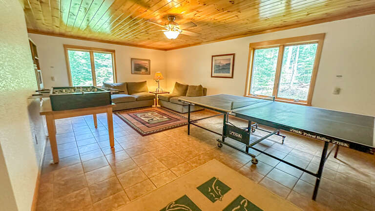 The bunk house game room has a ping pong and foosball table.