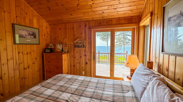 Views out the sliding glass door leading to the deck from Bedroom 1.