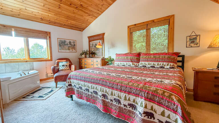 Bedroom 1 has a king bed and in-room jetted tub. Bedroom 1 has a king bed and in-room jetted tub.