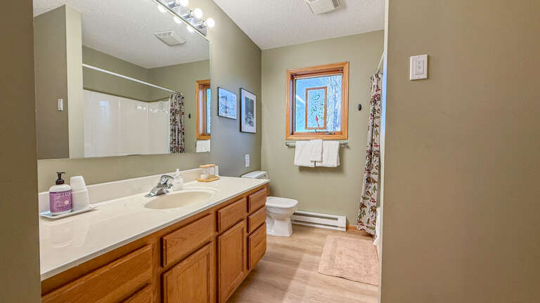 Bathroom 1 accessible from the hallway and Bedroom 1.