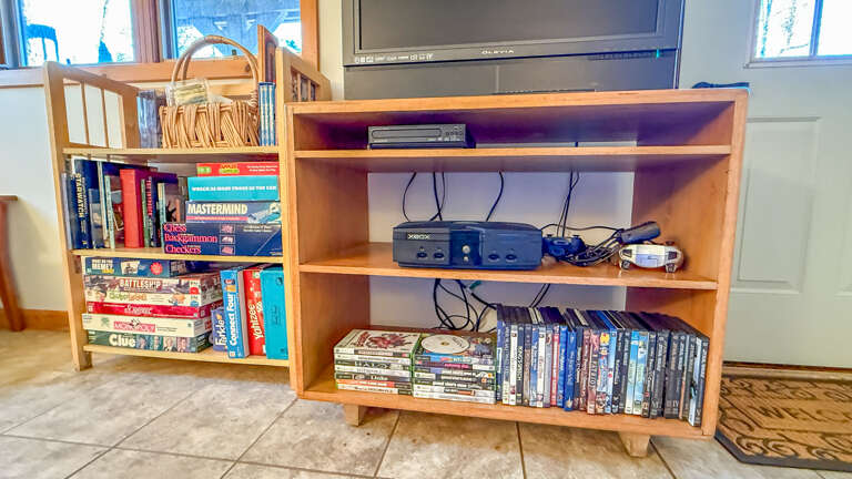 Selection of board games and Xbox games.