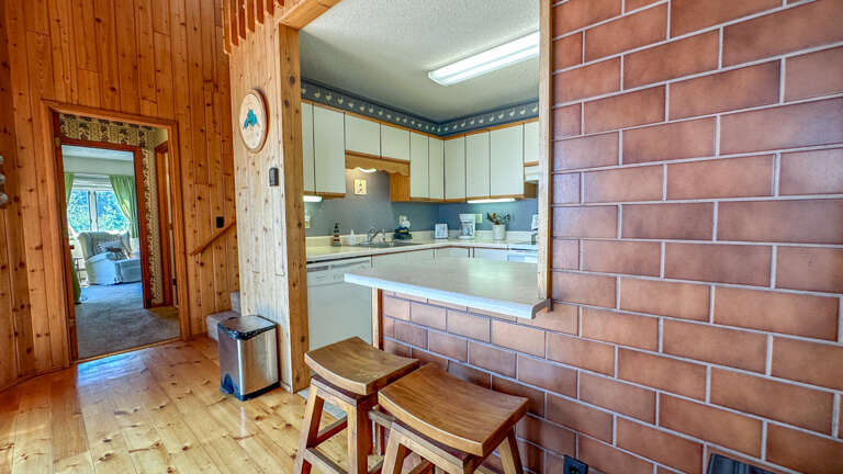Kitchen looking into the main floor bedroom.