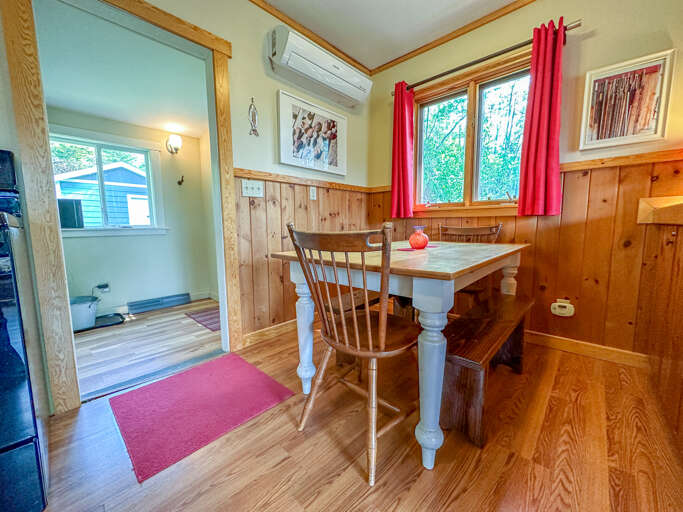 There is an AC in the dining room and seating for everyone at the dining room table.