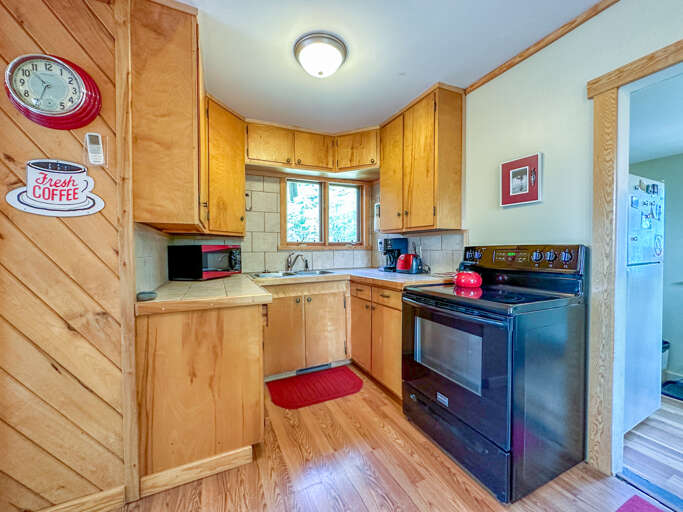 The kitchen is off to the dining room.