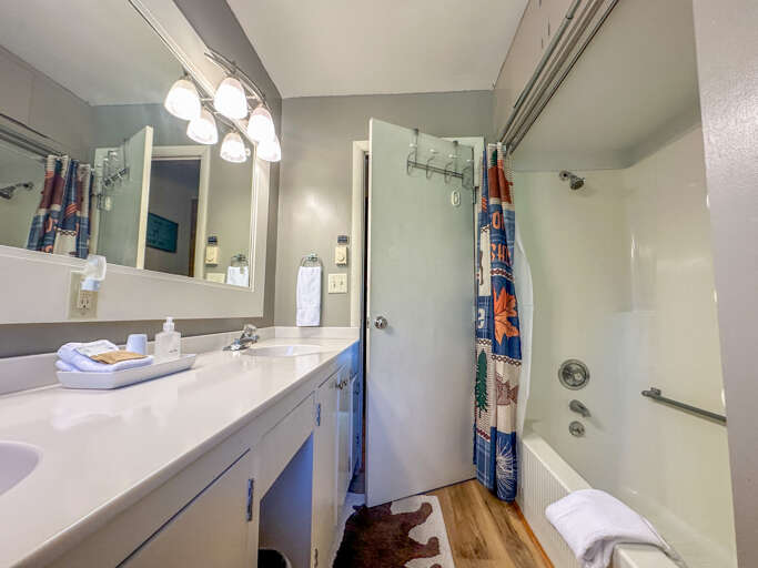This bathroom has a spacious vanity and a shower/tub combo. This bathroom has a spacious vanity and a shower/tub combo.