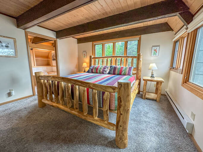 Bedroom 1 features a beautiful custom kind sized bed. Bedroom 1 features a beautiful custom kind sized bed.