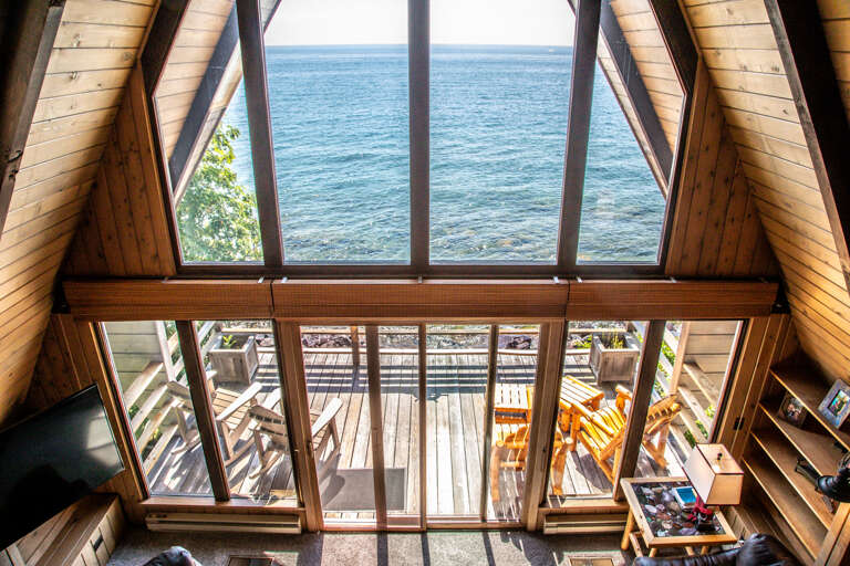 Enjoy floor to ceiling views of Lake Superior from the loft. Enjoy floor to ceiling views of Lake Superior from the loft.