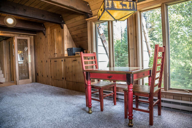 Also off of the living room is a small game area with board games and a table/chairs.
