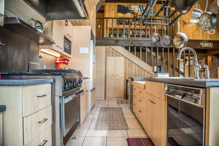 The kitchen is stocked with pots, pans, bakeware, plates, bowls, silerware, etc. The kitchen is stocked with pots, pans, bakeware, plates, bowls, silerware, etc.