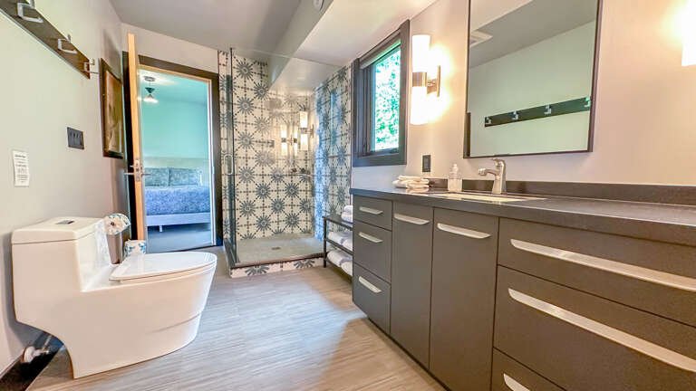 Attached bathroom, also has a door in the entryway hallway.