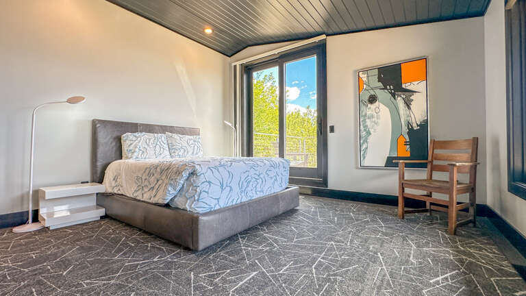 This room has a queen bed and attached balcony.