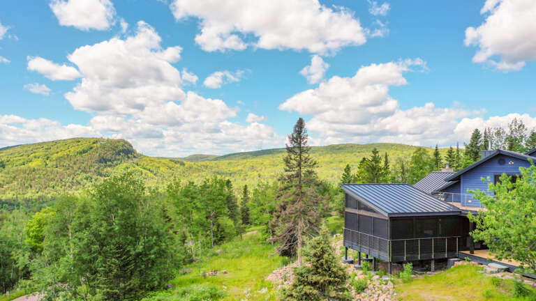 Blue House has uninterrupted views of Moose Mountain and Lake Superior from its mountaintop location.