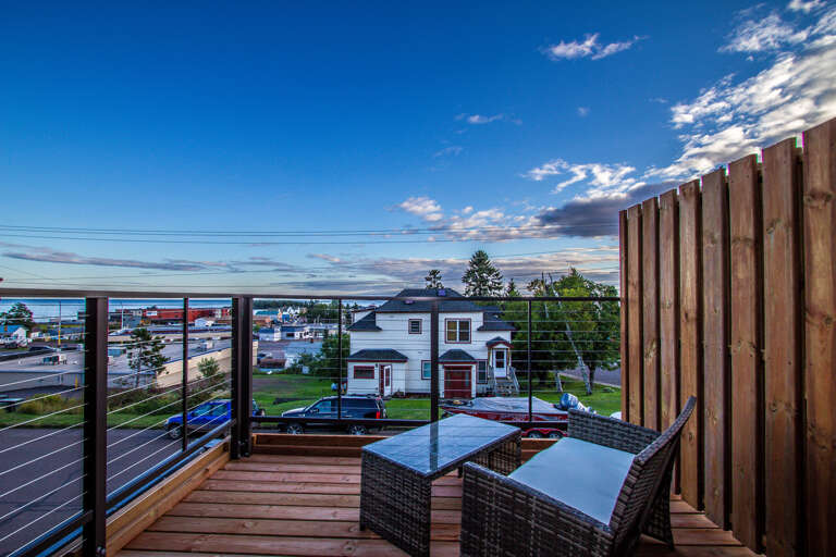 The balcony allow you to enjoy the scenic views of Lake Superior and the Grand Marais Harbor.