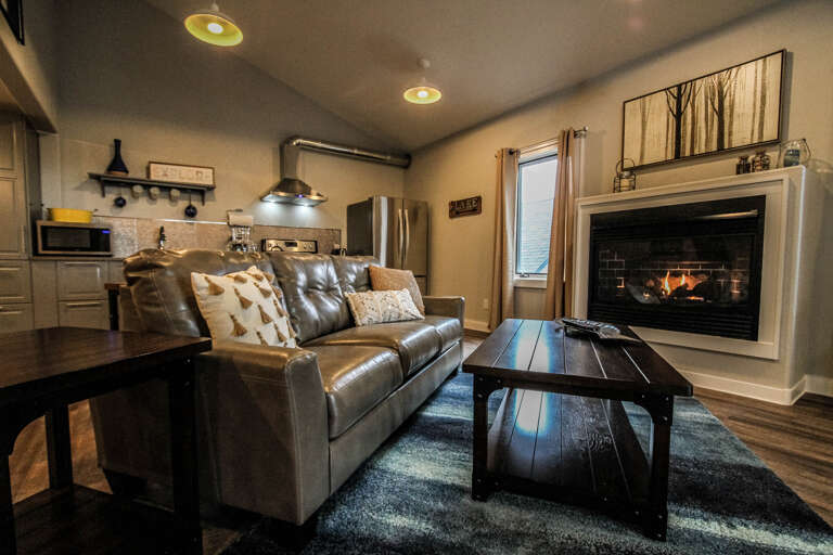 Relax by the fireplace and enjoy a good book.