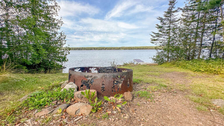 Have a cozy campfire just steps away from the lake.