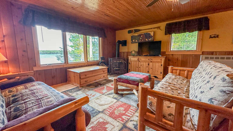 The living room has a gas fireplace and TV.