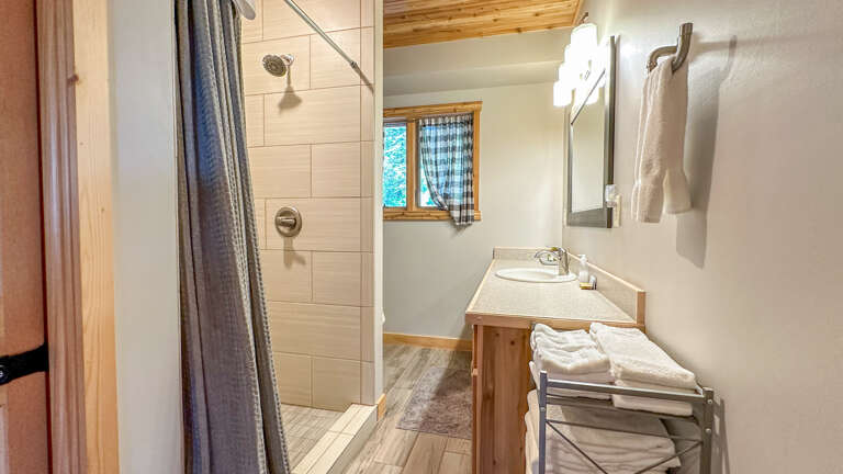 Bathroom 1 is located on the main level and has a shower.