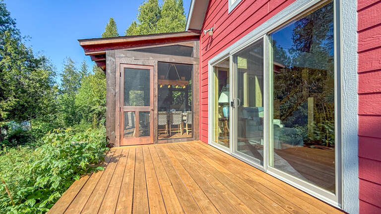 Step out onto your private deck, where fresh mountain air and lush forest views greet you. A screened porch provides the perfect spot to unwind with morning coffee or watch the sunset in comfort.