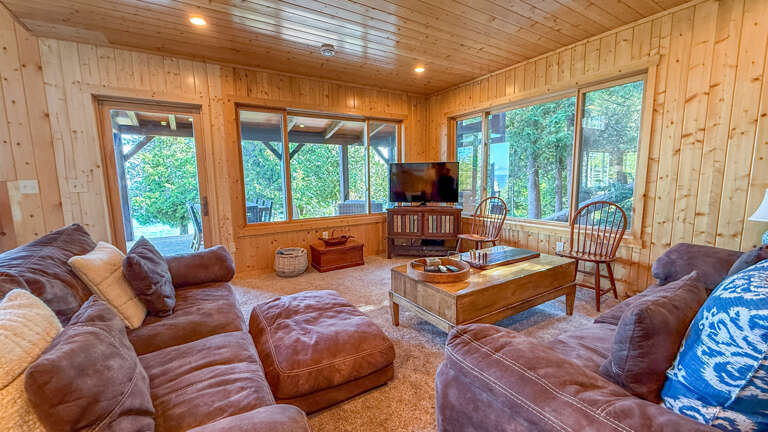 The family room features a TV. The family room features a TV.