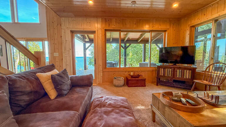 New windows and doors in the living room leading out to the new deck. New windows and doors in the living room leading out to the new deck.