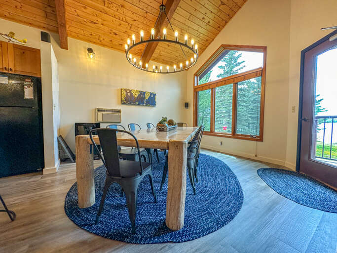 Enjoy a meal at the dining room table with for 8 guests.