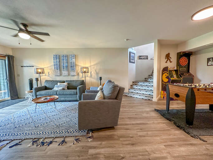 The lower level living room also has a game room area.