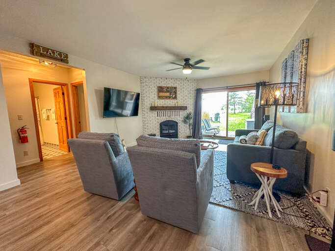 The lower level living room offer a tv and a wood burning fireplace.