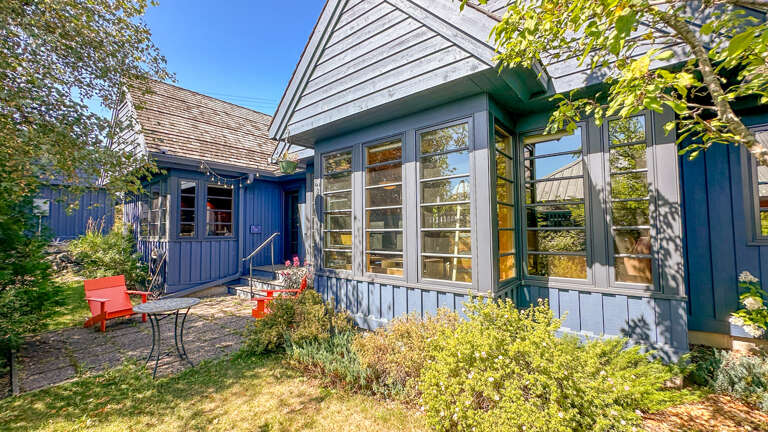 With every detail crafted by the areaâs top home builders, with sustainable practices in mind such as cork floors, this light wood-paneled home creates a bright and airy feeling.