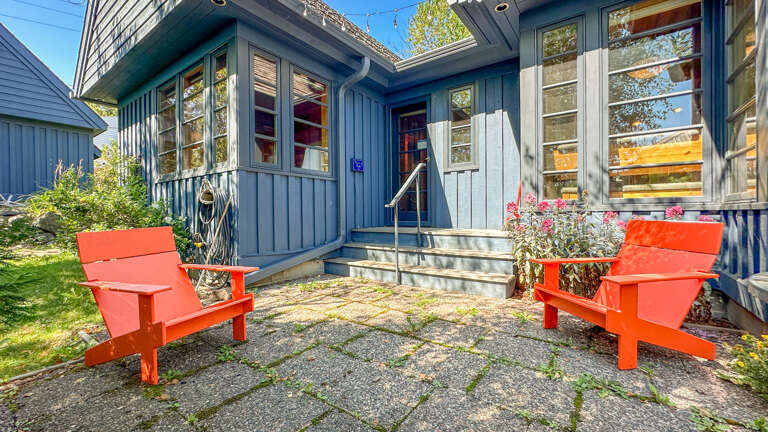 The home features a beautiful open living area with a kitchen, dining room, and living room. The two bedrooms share a beautifully designed custom bathroom.