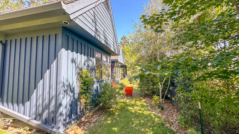 Although right in the middle of town, this home has been carefully positioned on the property to give you the utmost amount of privacy for an in-town home.