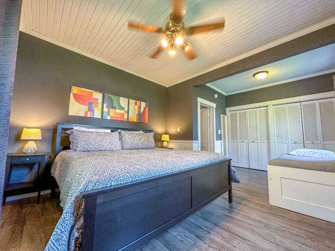 Bedroom 1 features a King Bed and Day Bed with Trundle bed.