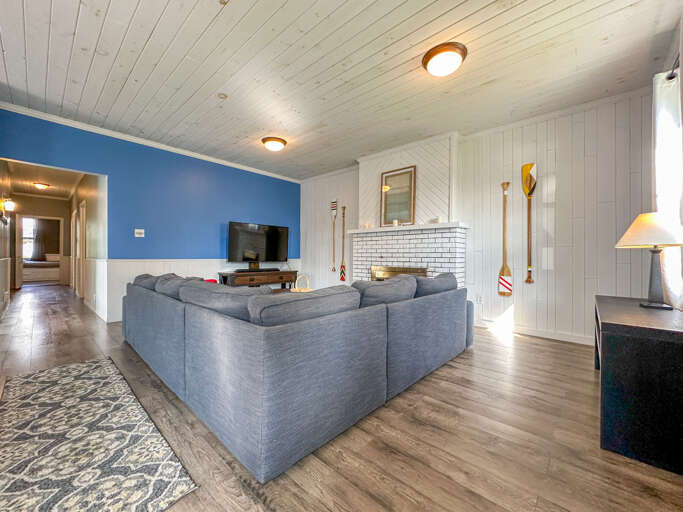 The cozy living room is the perfect place to curl up and relax after a day of exploring the North Shore.