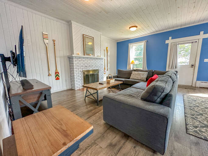 Please note that the fireplace is not functional. The living room also features a TV.