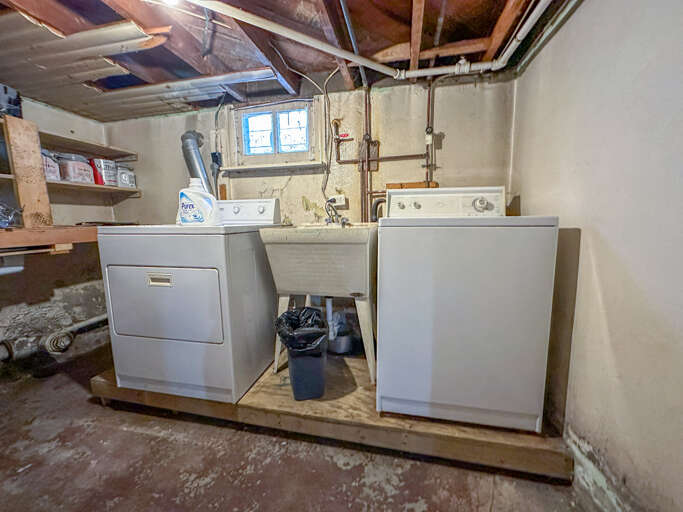 There is a washer and dryer in the basement of the home.
