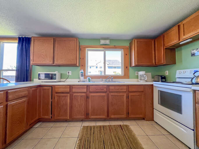 Enjoy preparing homecooked meals in the spacious kitchen.