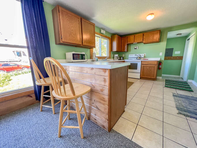 Kitchen with seating at the counter.